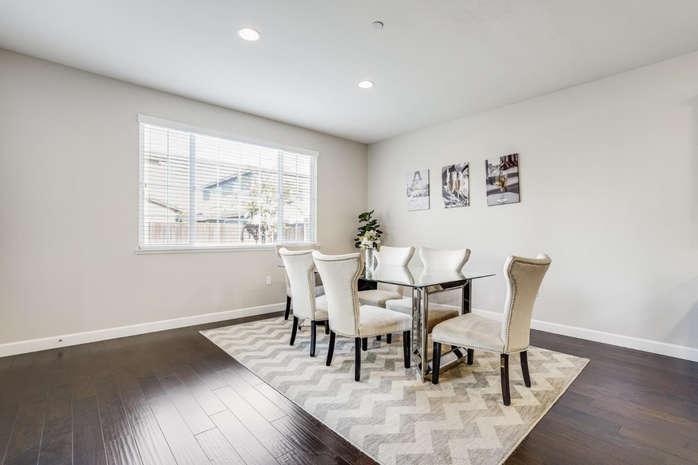 333 Calle Cerro Morgan Hill, CA 95037 - Photo 19 of 45 a dining room with wooden floor and a window
