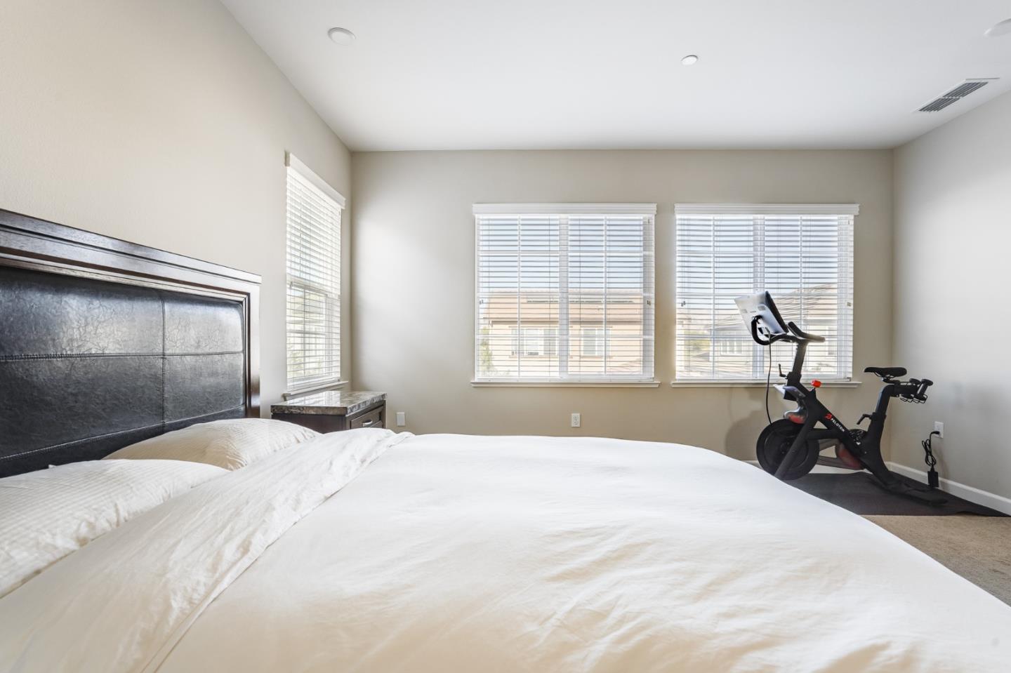 333 Calle Cerro Morgan Hill, CA 95037 - Photo 23 of 45 a bedroom with a bed and wooden floor