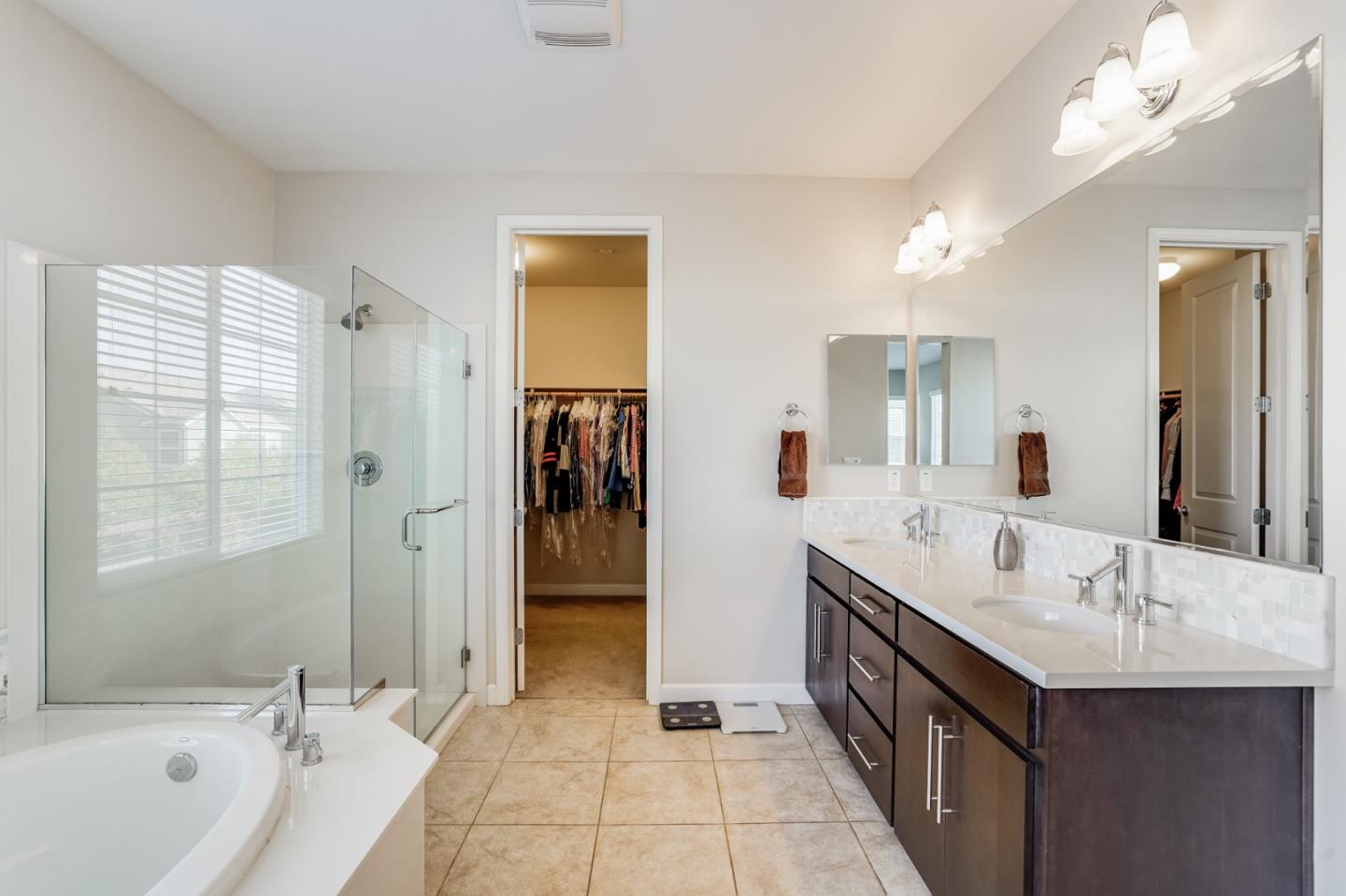 333 Calle Cerro Morgan Hill, CA 95037 - Photo 26 of 45 a spacious bathroom with a tub sink shower and mirror