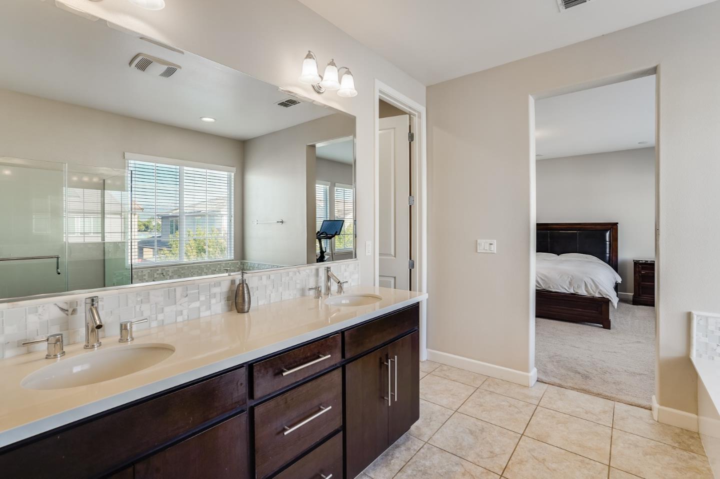 333 Calle Cerro Morgan Hill, CA 95037 - Photo 27 of 45 a en suite bathroom with a sink double vanity and a mirror