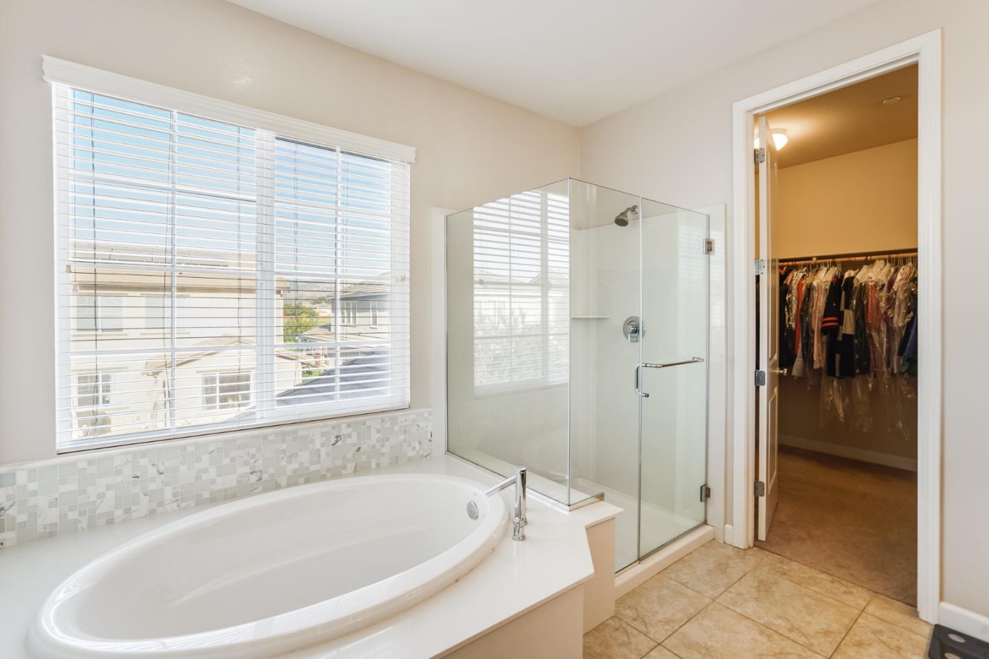 333 Calle Cerro Morgan Hill, CA 95037 - Photo 28 of 45 a white bath tub sitting in a bathroom next to a window
