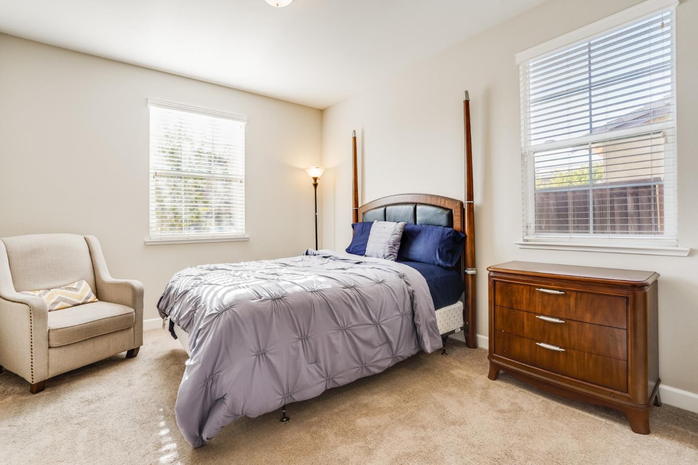 333 Calle Cerro Morgan Hill, CA 95037 - Photo 4 of 45 a bedroom with a bed couch and window