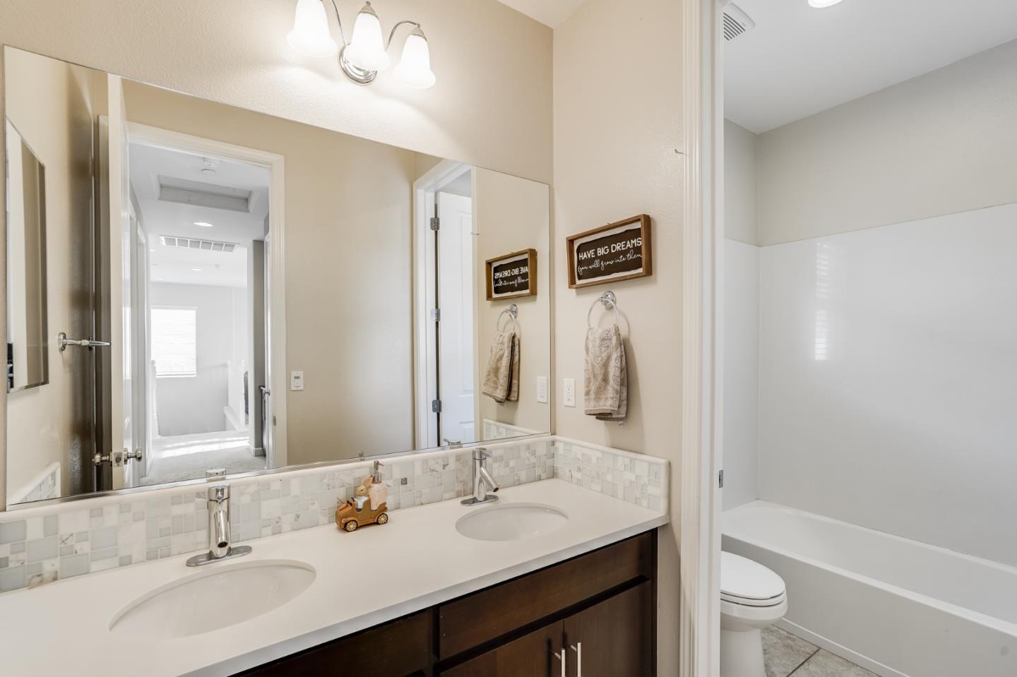 333 Calle Cerro Morgan Hill, CA 95037 - Photo 32 of 45 a bathroom with a granite countertop sink toilet and shower