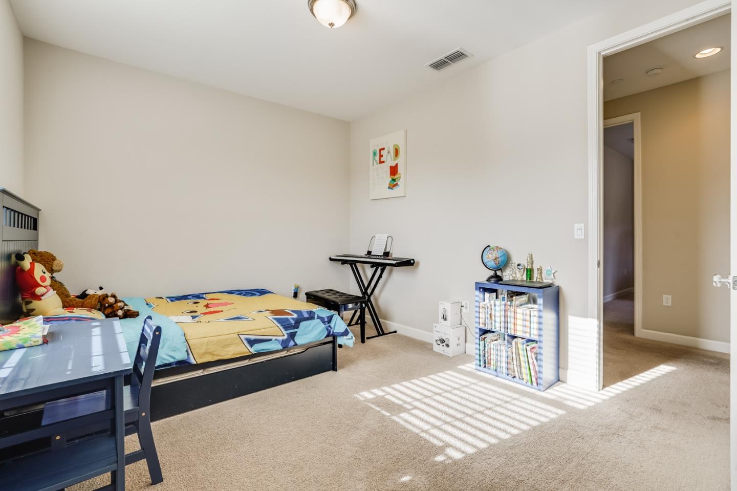 333 Calle Cerro Morgan Hill, CA 95037 - Photo 34 of 45 a bedroom with a bed and a table in it