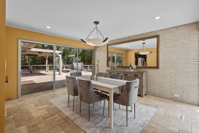 a dining room with furniture and window