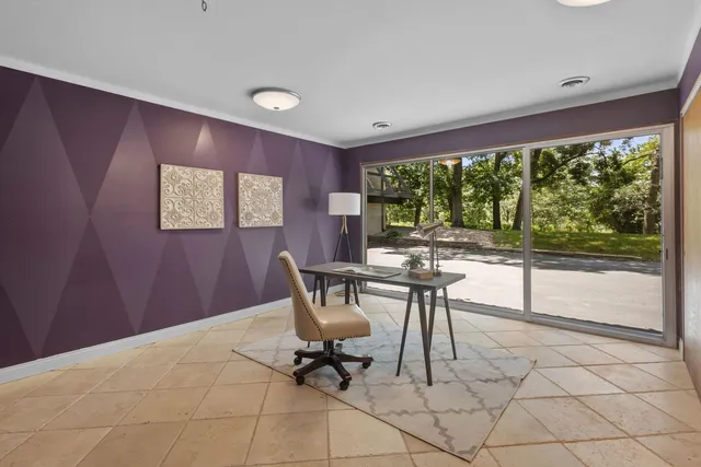 a workspace with furniture and a window