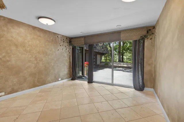 a view of a room with a large window