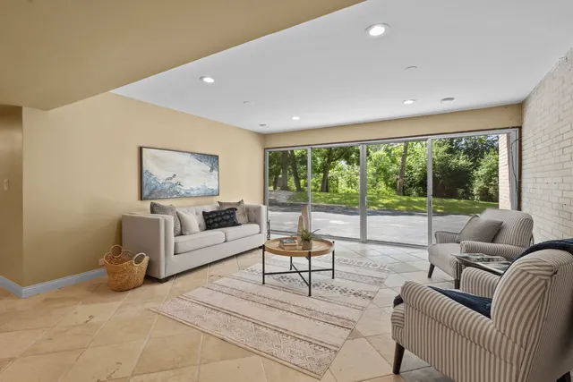 swimming pool view with a seating space