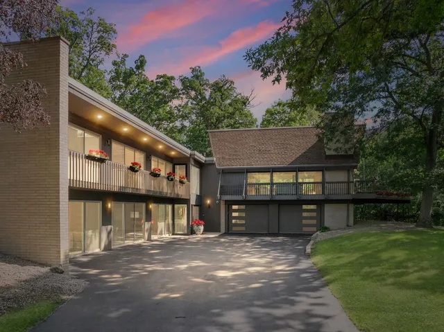 a view of a house with a yard and a patio