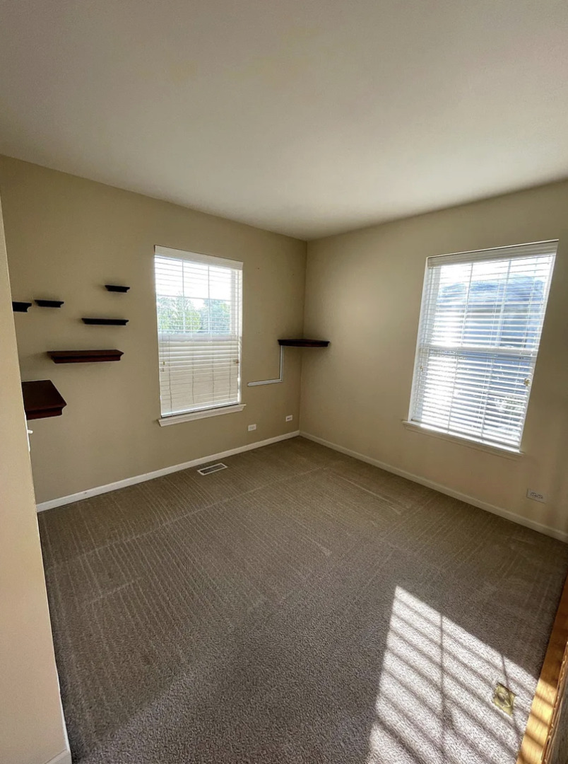 2326 Sunshine Lane Aurora, IL 60503 - Photo 11 of 27 an empty room with windows