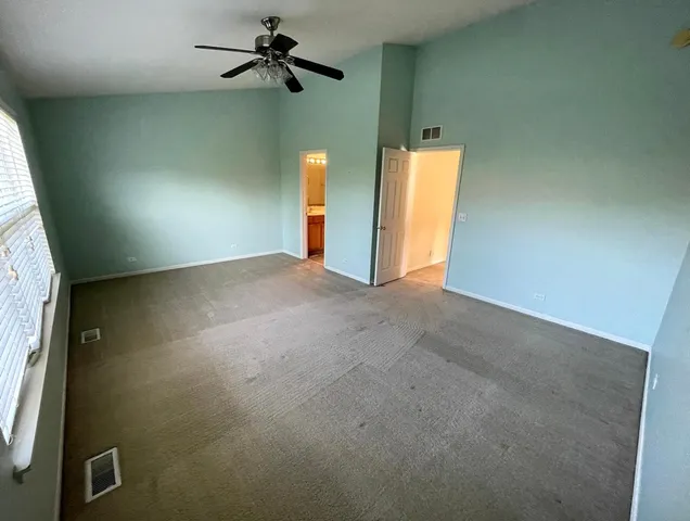 a view of empty room with windows