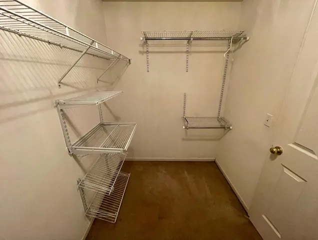a view of a room with racks on the wall