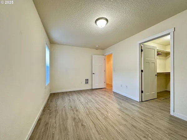 a view of wooden floor in an empty room