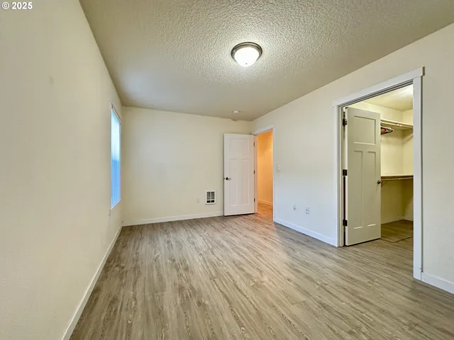 a view of wooden floor in an empty room