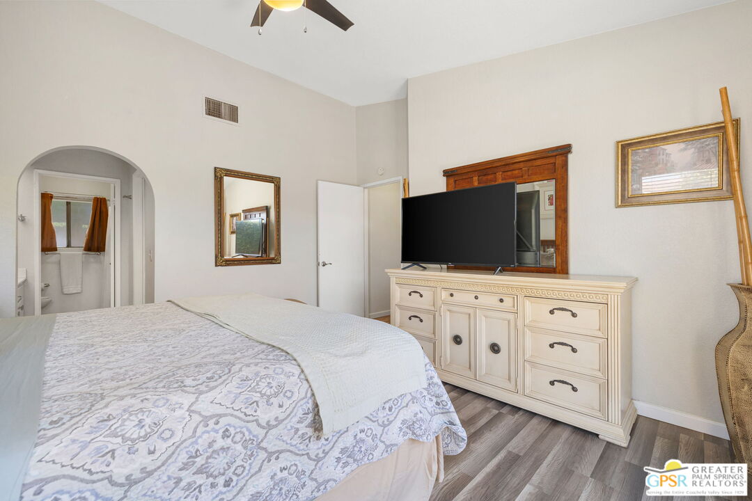 45688 Sutter Creek Road Indio, CA 92201 - Photo 25 of 51 a bedroom with furniture and a flat screen tv