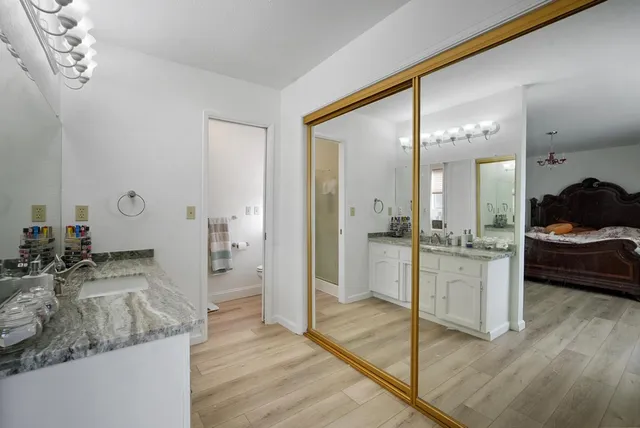 a kitchen with sink and refrigerator