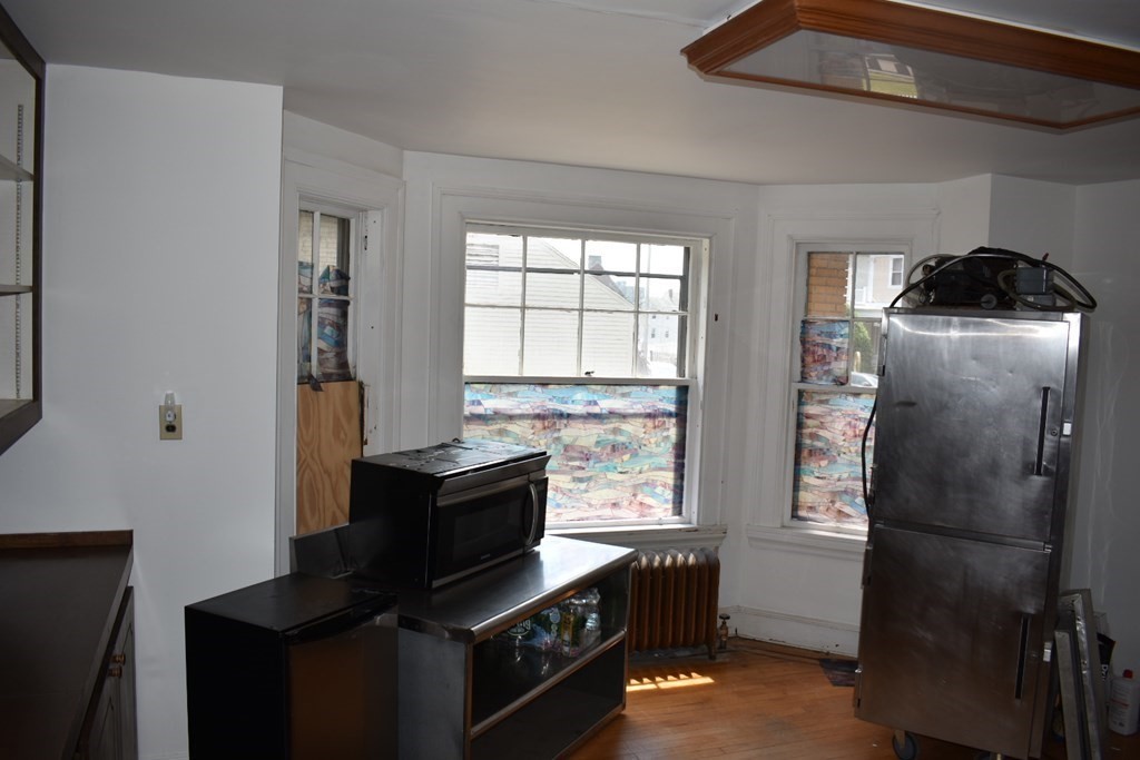 321 North Main Street Fall River, MA 02720 - Photo 17 of 38 a kitchen with a stove and a refrigerator