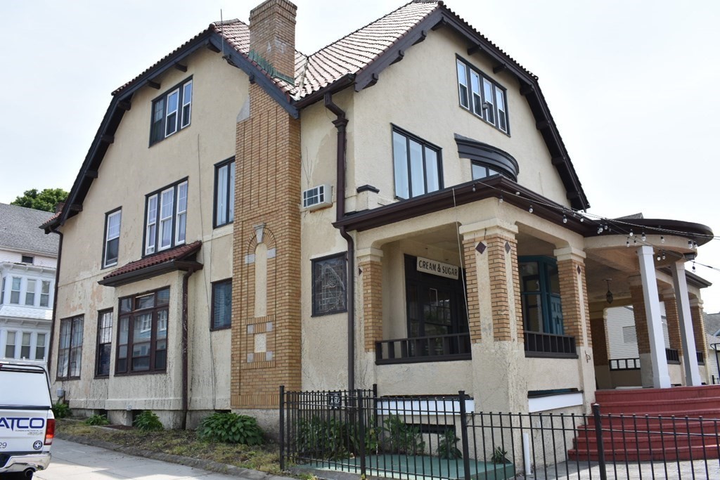 321 North Main Street Fall River, MA 02720 - Photo 5 of 38 a view of a white house with large windows