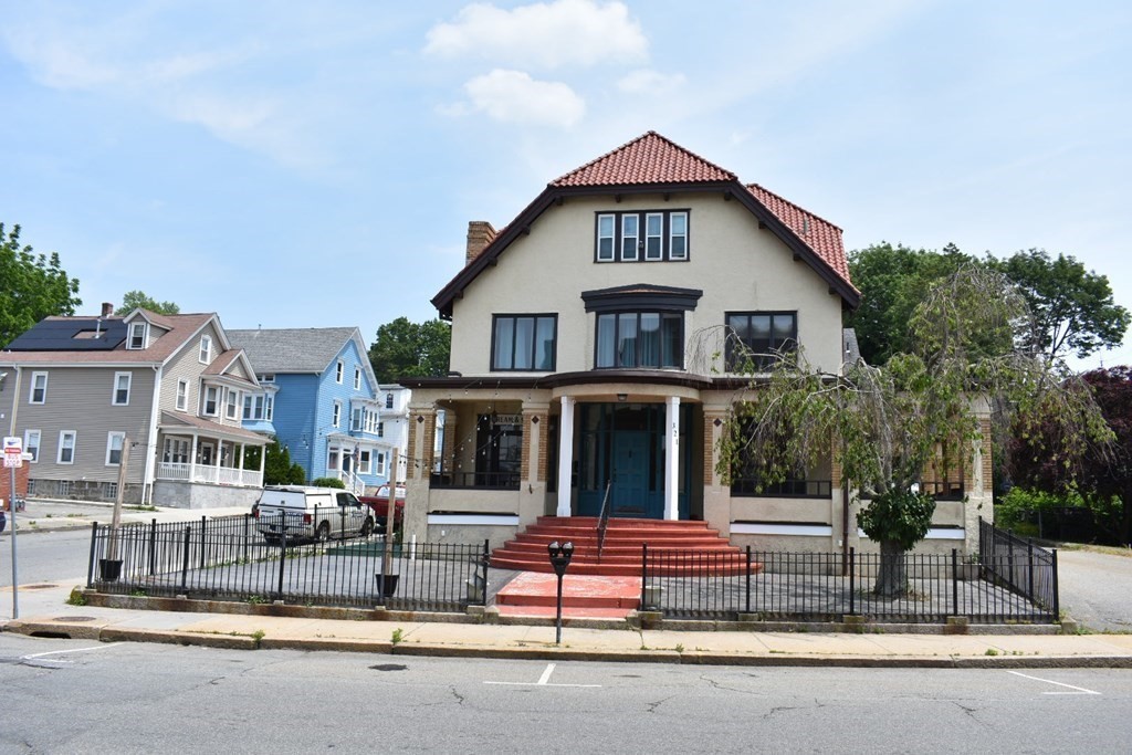 321 North Main Street Fall River, MA 02720 - Photo 6 of 38 a front view of a house with a garden