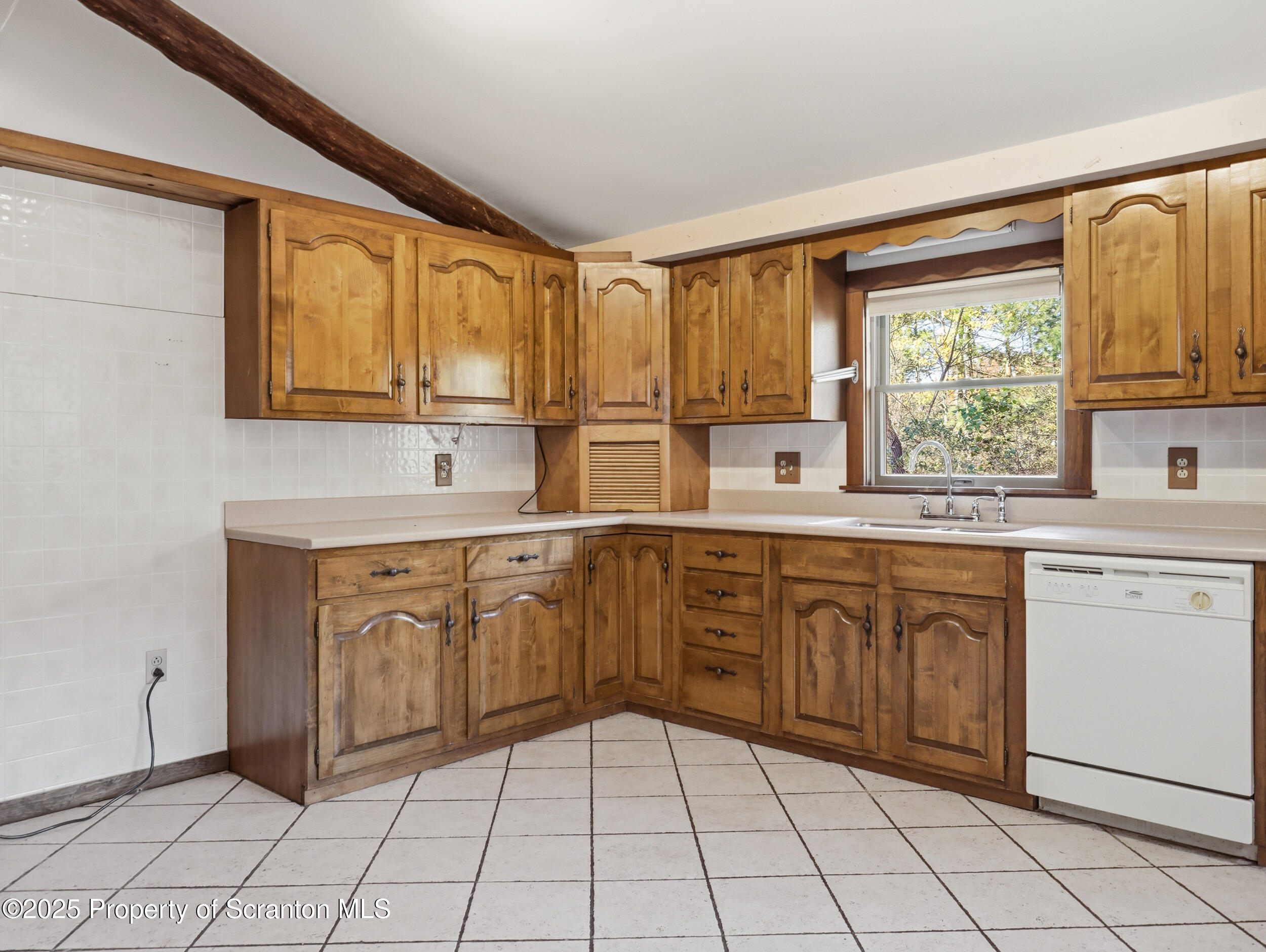 1 Ford Drive Tunkhannock, PA 18657 - Photo 9 of 33 a kitchen with a sink window and cabinets