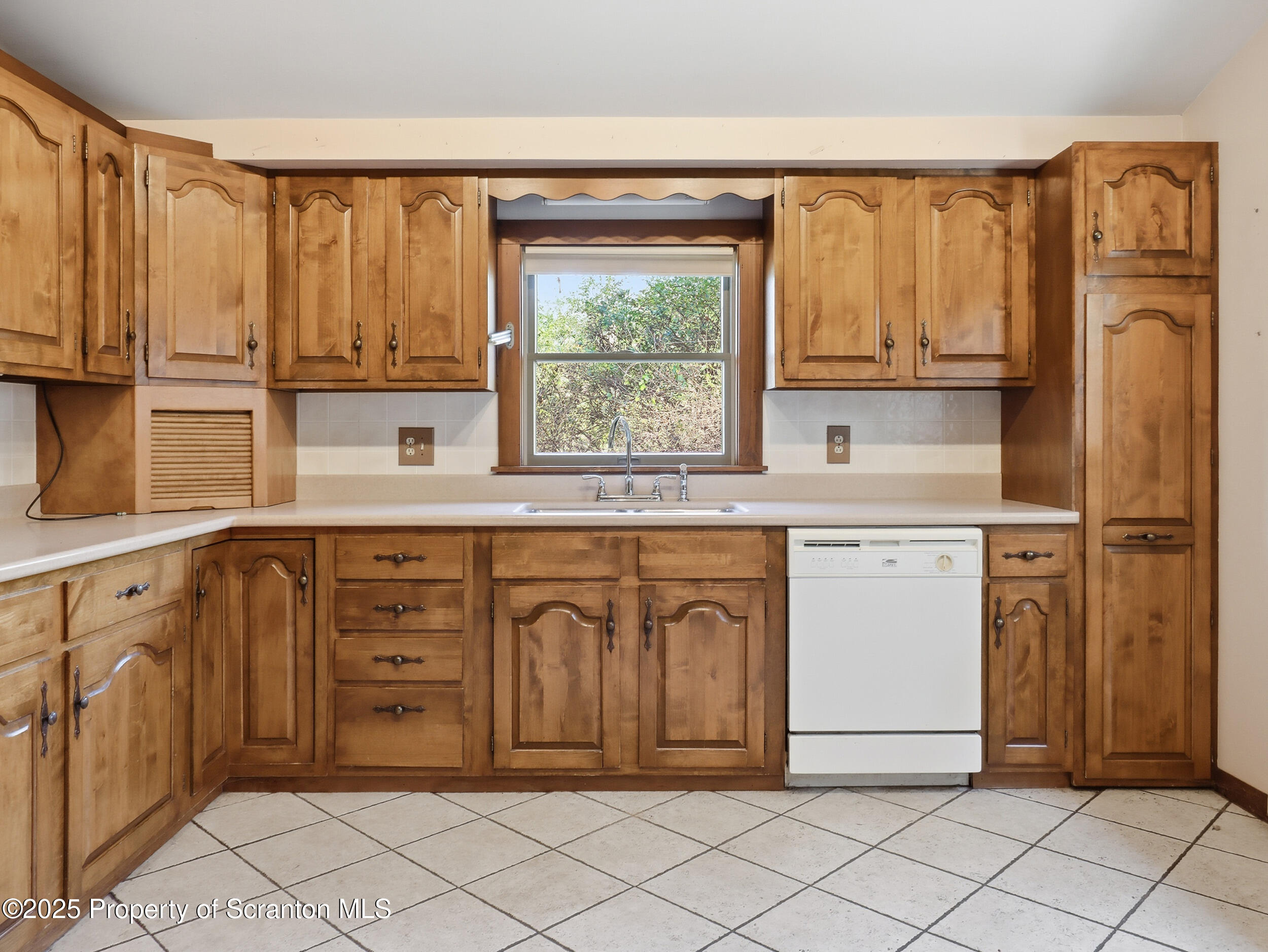 1 Ford Drive Tunkhannock, PA 18657 - Photo 10 of 33 a utility room with stainless steel appliances a sink window and cabinets