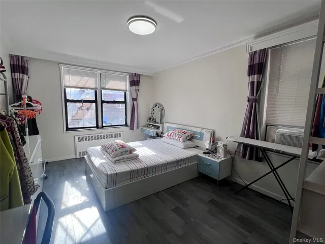 a bedroom with bed and window