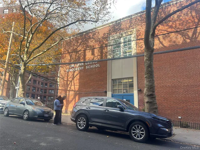 a view of a car parked in front of a house