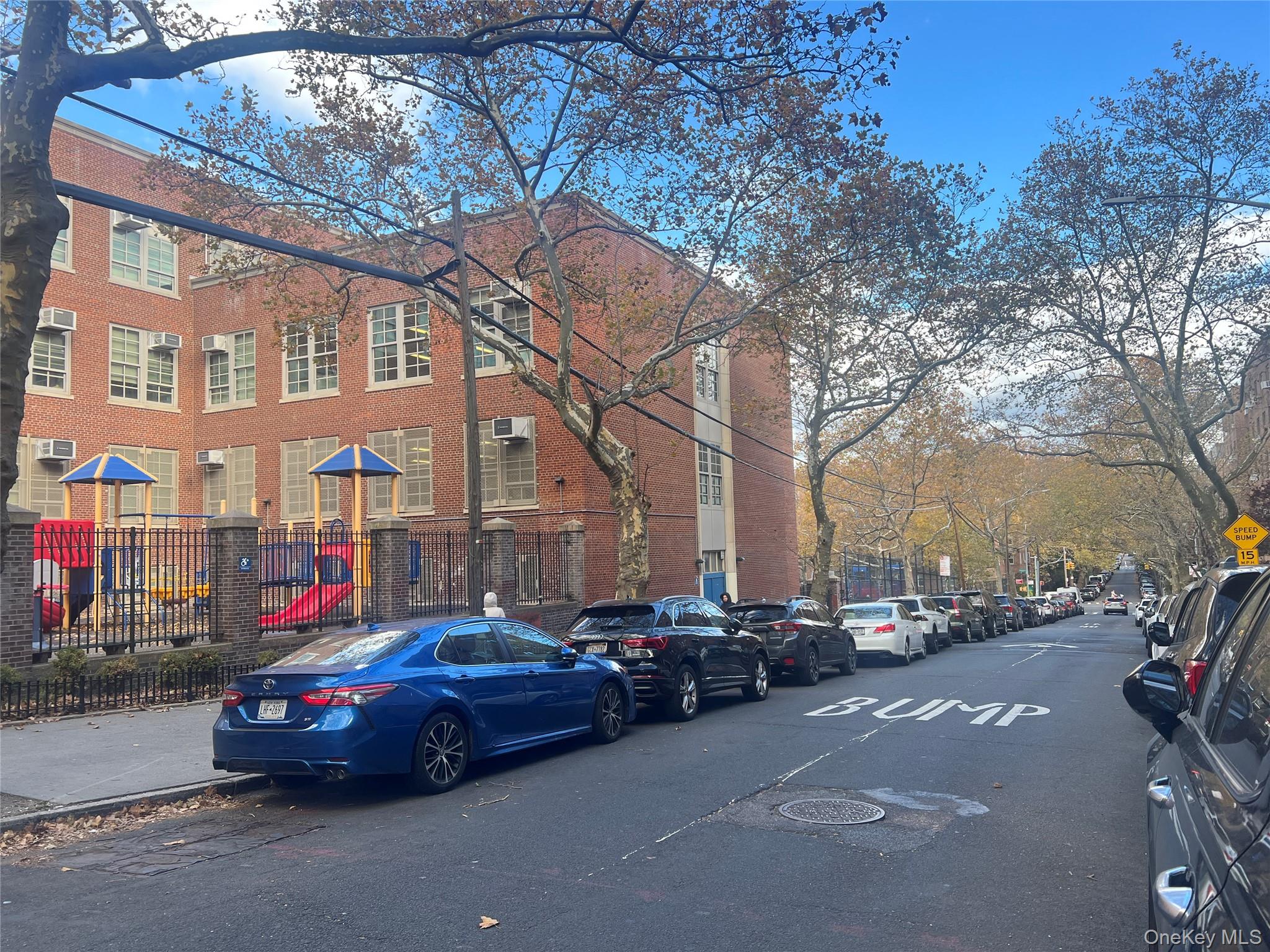 102-32 65th Avenue, Unit B37 Queens, NY 11375 - Photo 20 of 23 a car parked in front of a building