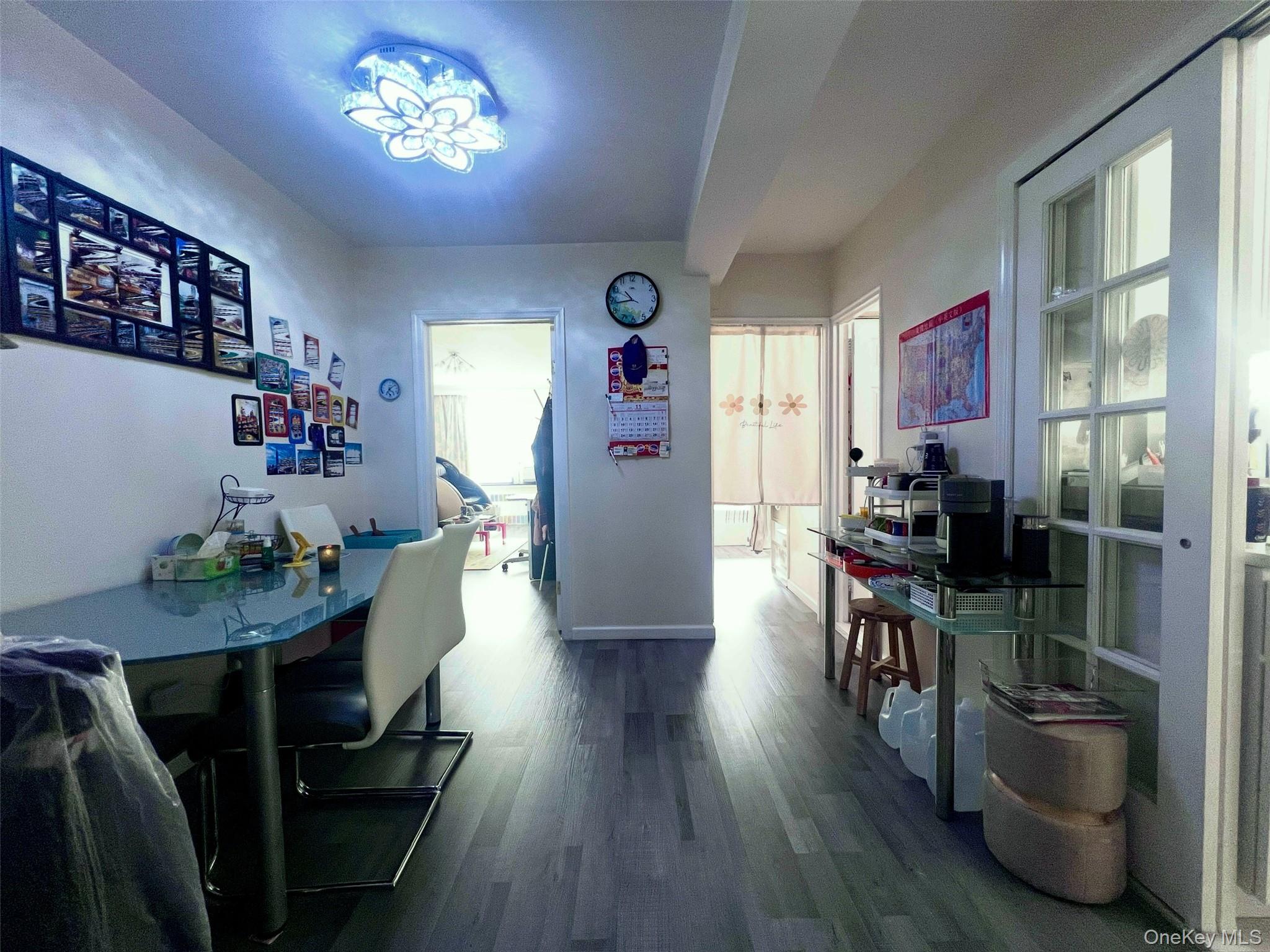 102-32 65th Avenue, Unit B37 Queens, NY 11375 - Photo 7 of 23 a view of a dining room with furniture window and wooden floor