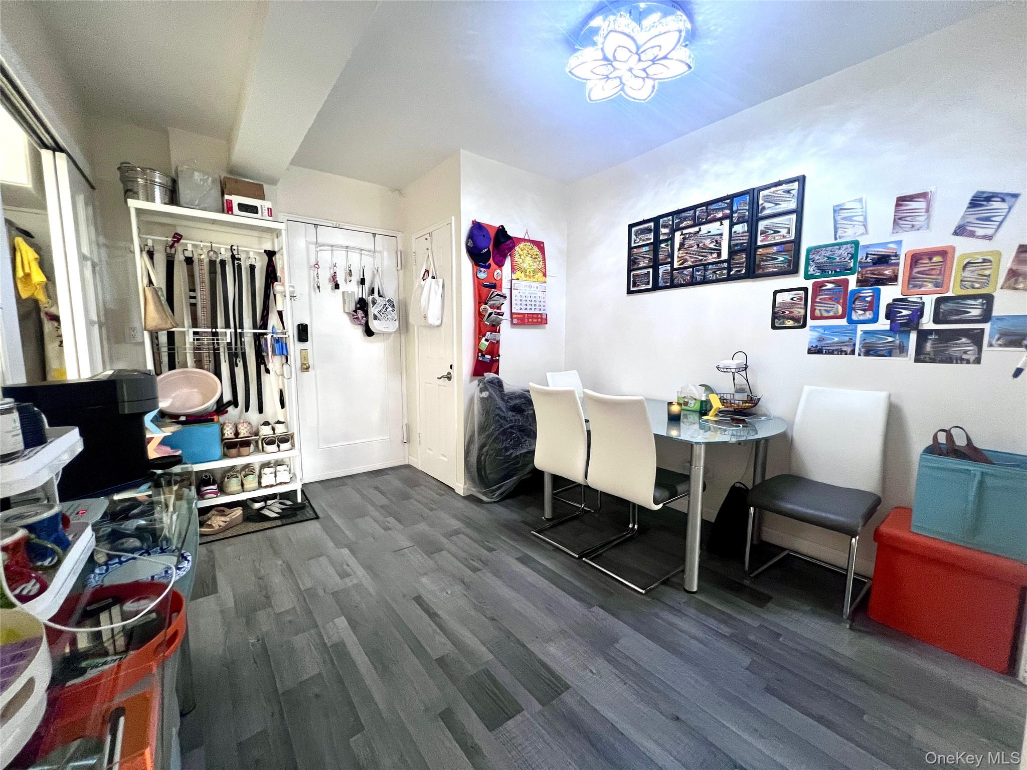 102-32 65th Avenue, Unit B37 Queens, NY 11375 - Photo 8 of 23 a living room with furniture and a wooden floor