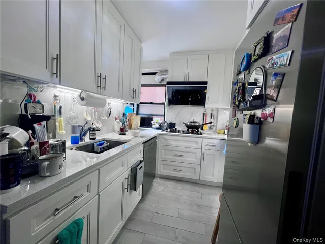 a kitchen with cabinets and a stove