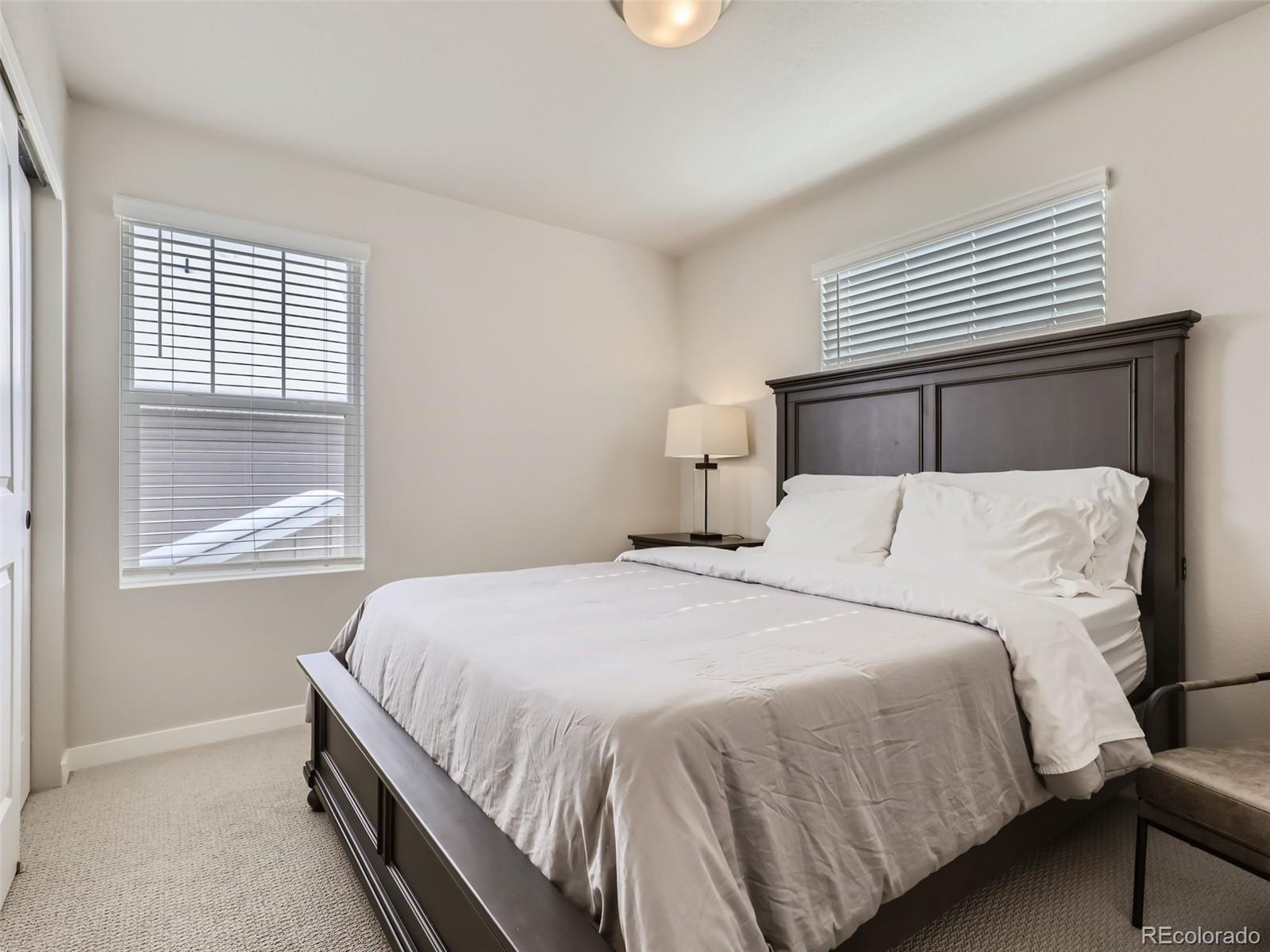 4495 Riviera Court Aurora, CO 80019 - Photo 17 of 28 a bedroom with a bed and a window