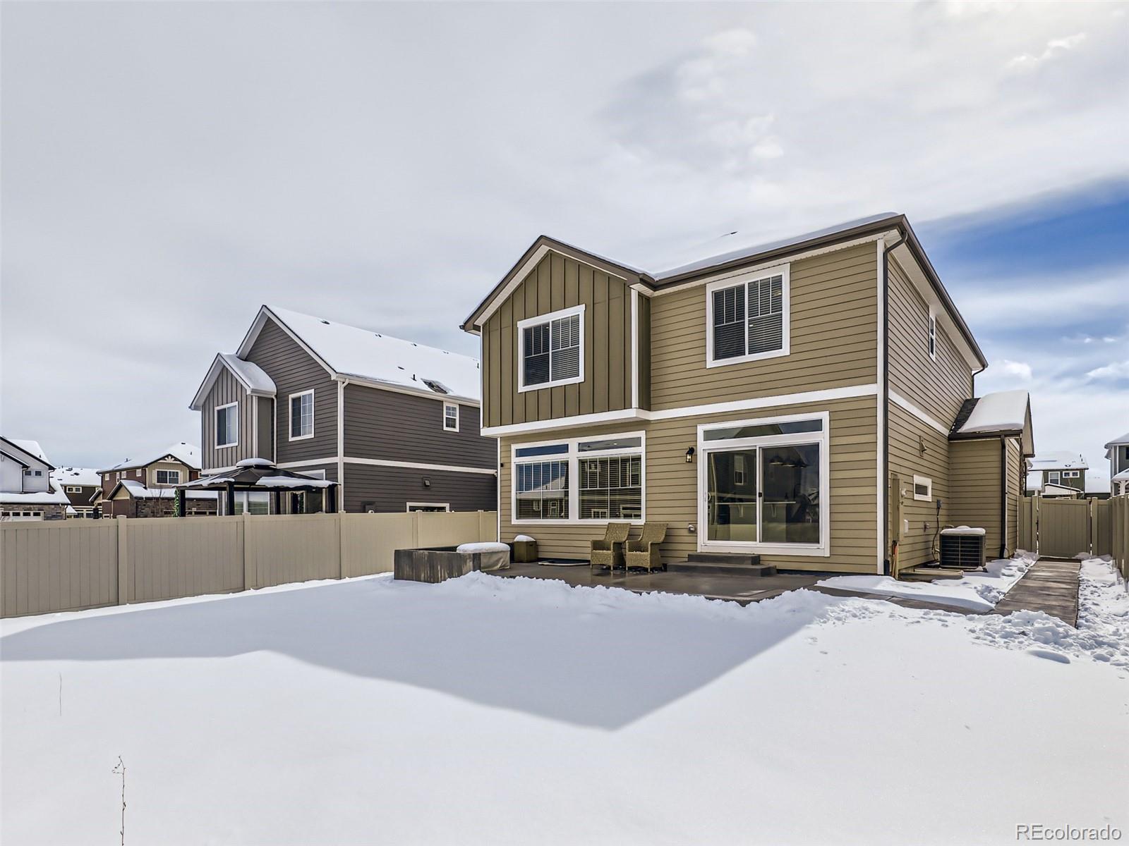 4495 Riviera Court Aurora, CO 80019 - Photo 21 of 28 a front view of a house with a yard