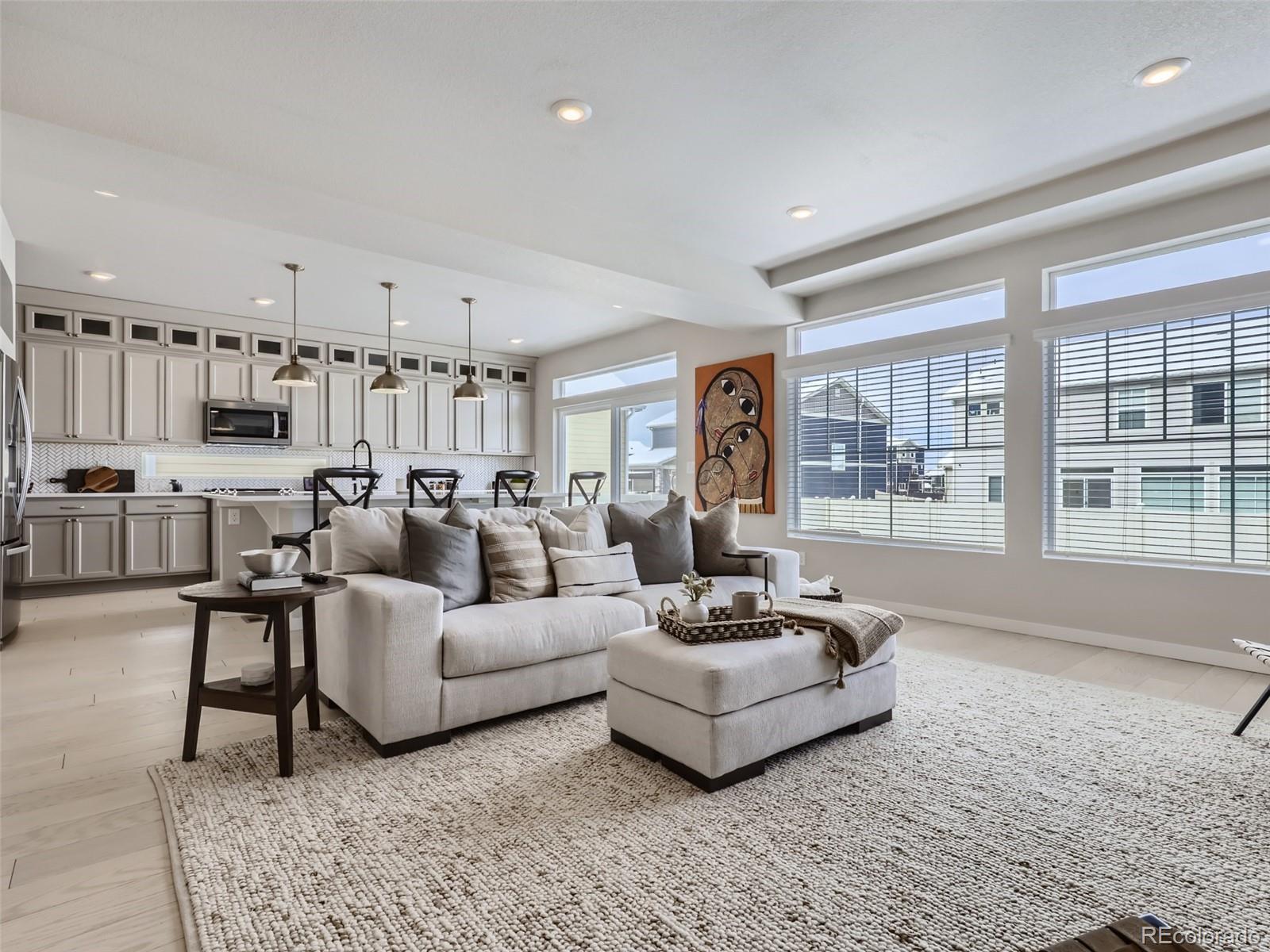 4495 Riviera Court Aurora, CO 80019 - Photo 28 of 28 a living room with furniture and a large window