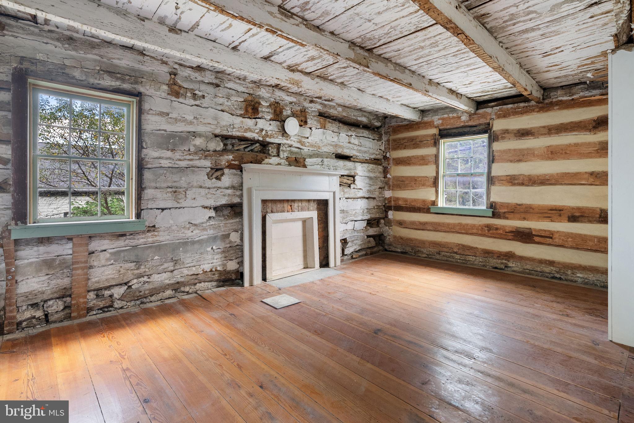 7379 Queen Street Middleway, WV 25430 - Photo 26 of 58 a view of a room with wooden floors and fireplace