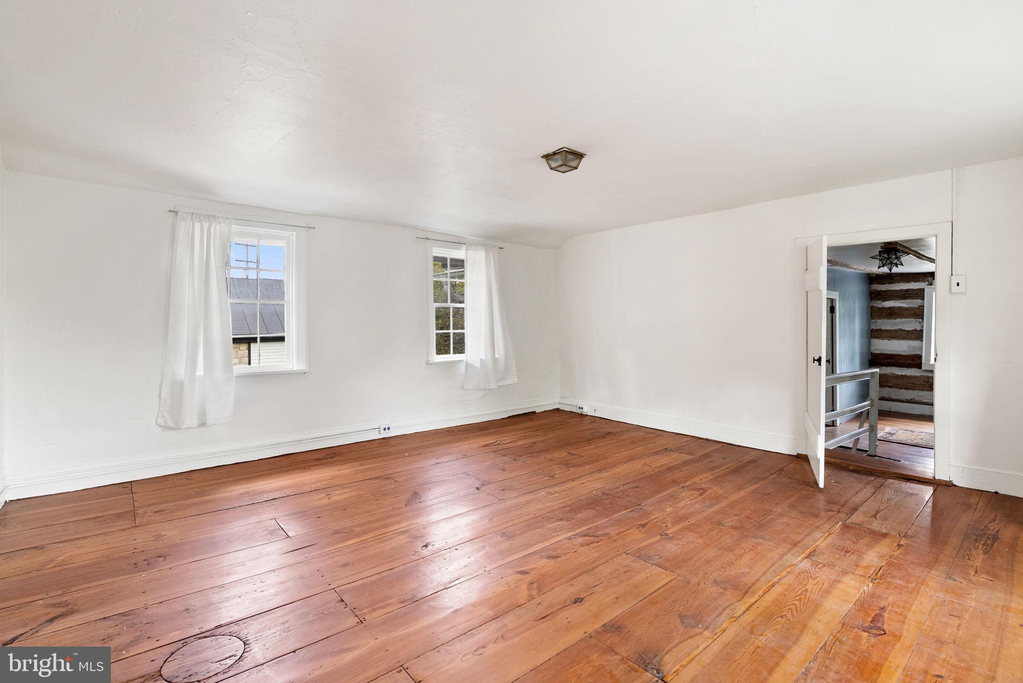 7379 Queen Street Middleway, WV 25430 - Photo 28 of 58 wooden floor in an empty room with a window