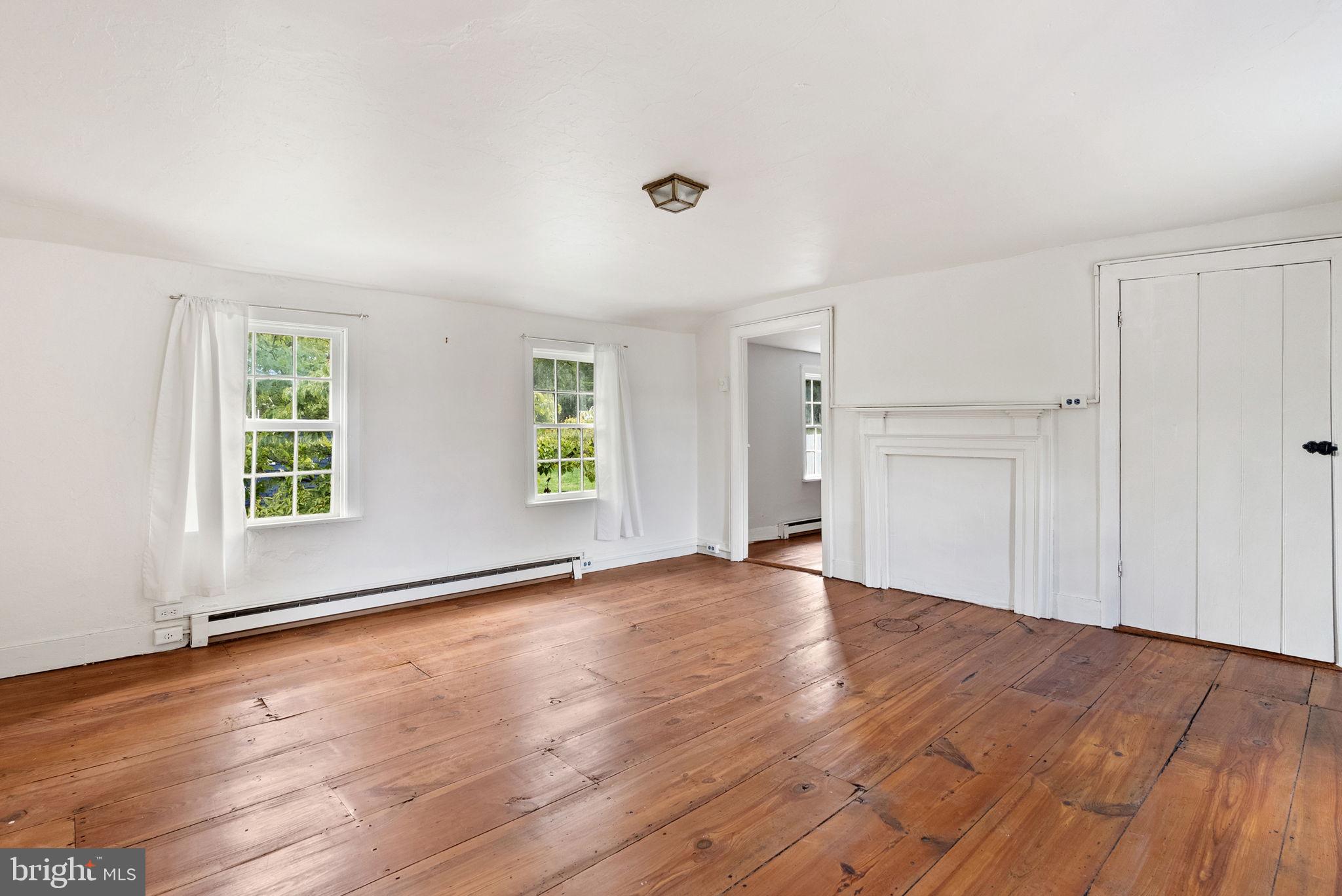 7379 Queen Street Middleway, WV 25430 - Photo 30 of 58 an empty room with wooden floor and windows