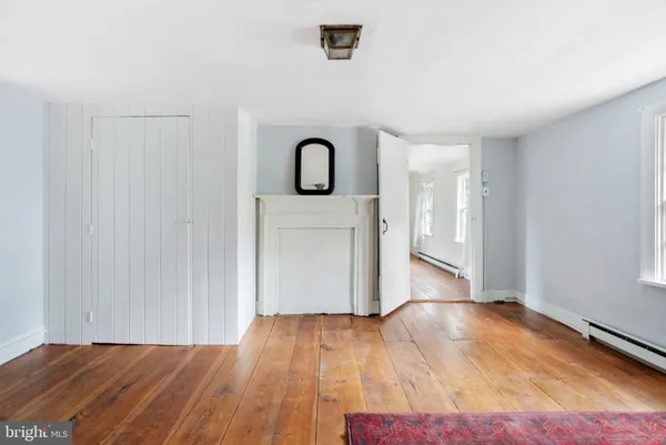 a view of a porch with furniture and garden