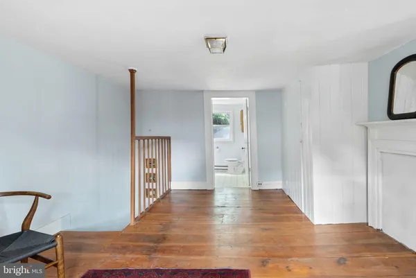 a view of a deck with chair and wooden floor