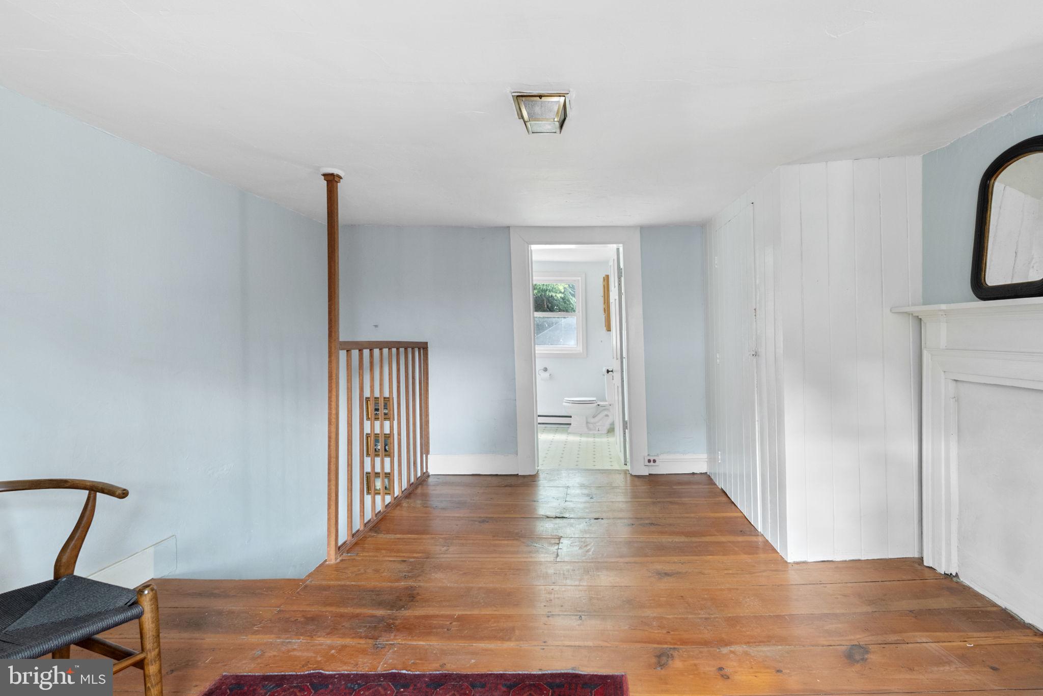 7379 Queen Street Middleway, WV 25430 - Photo 32 of 58 a view of a hallway with wooden floor and chair