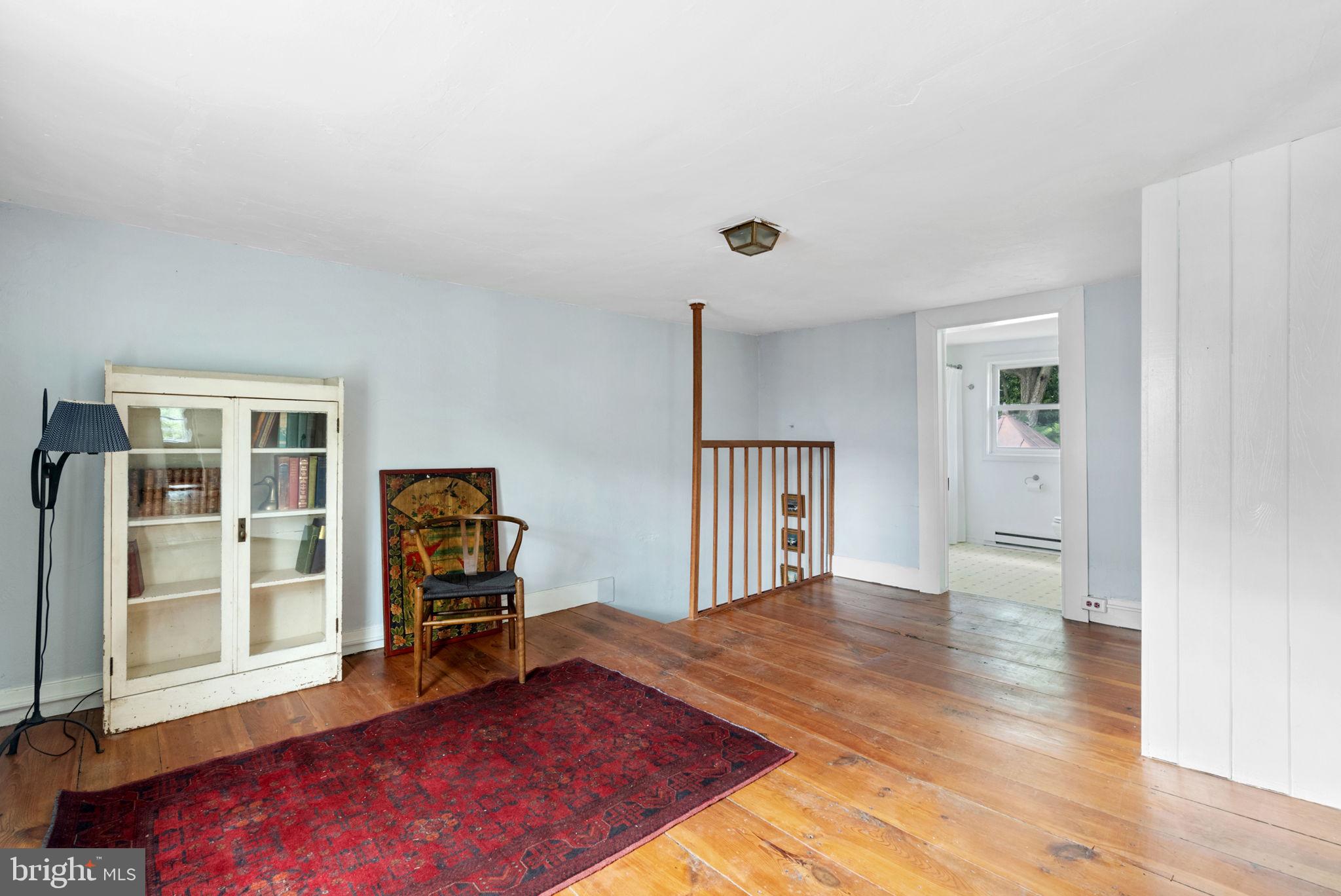 7379 Queen Street Middleway, WV 25430 - Photo 33 of 58 a view of an empty room with window and wooden floor