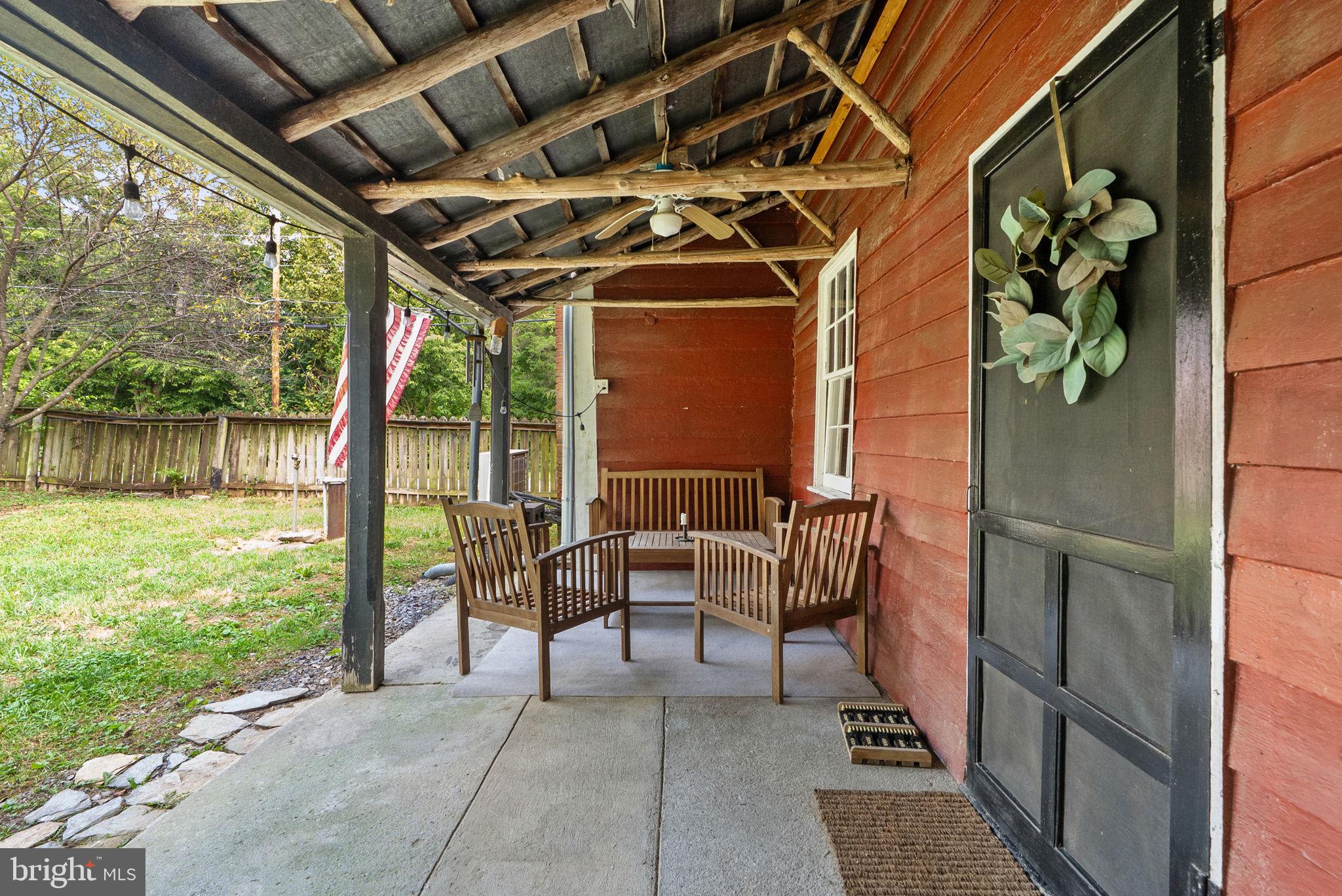 7379 Queen Street Middleway, WV 25430 - Photo 38 of 58 a view of a porch with furniture and garden