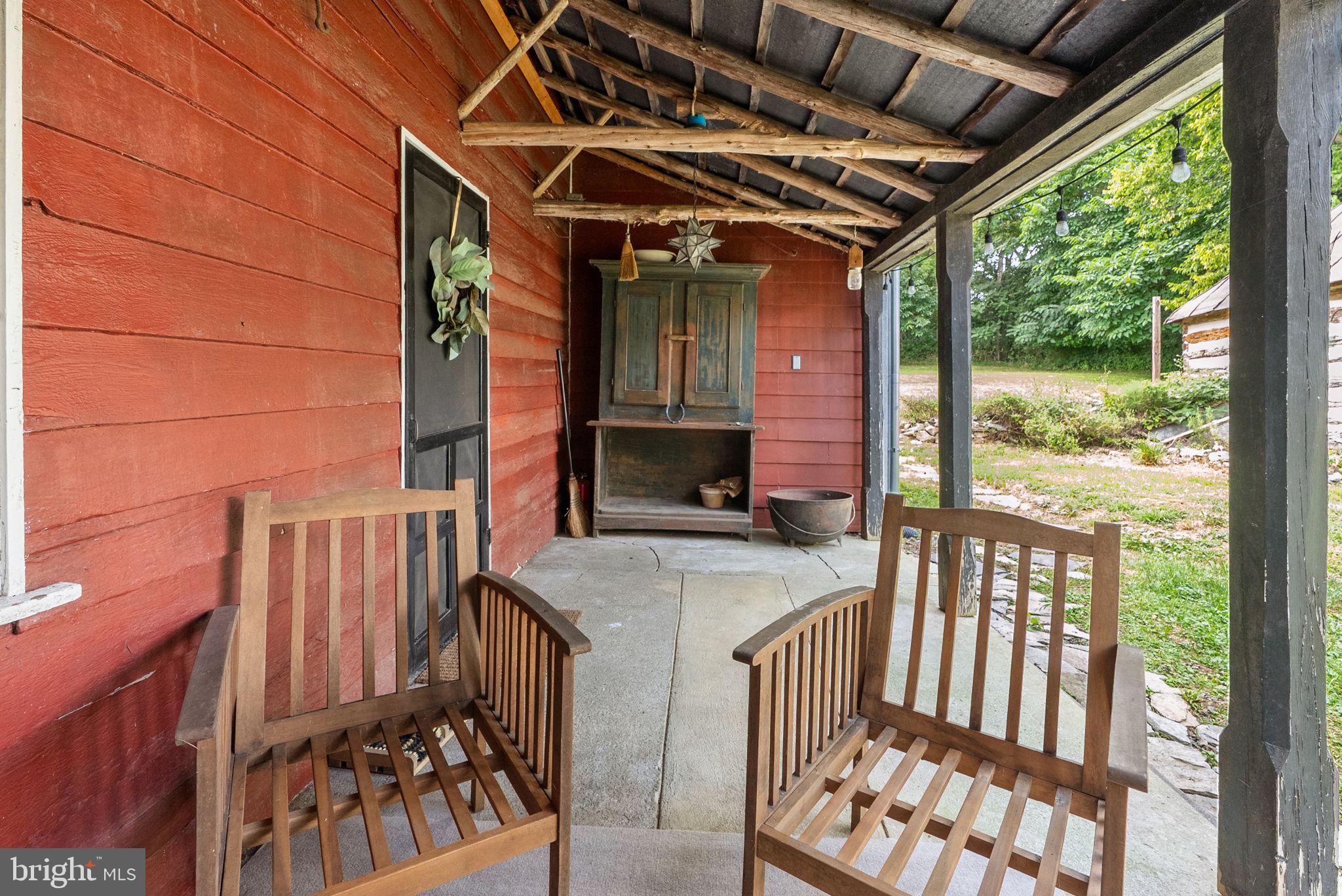 7379 Queen Street Middleway, WV 25430 - Photo 40 of 58 a view of porch with a table and chairs