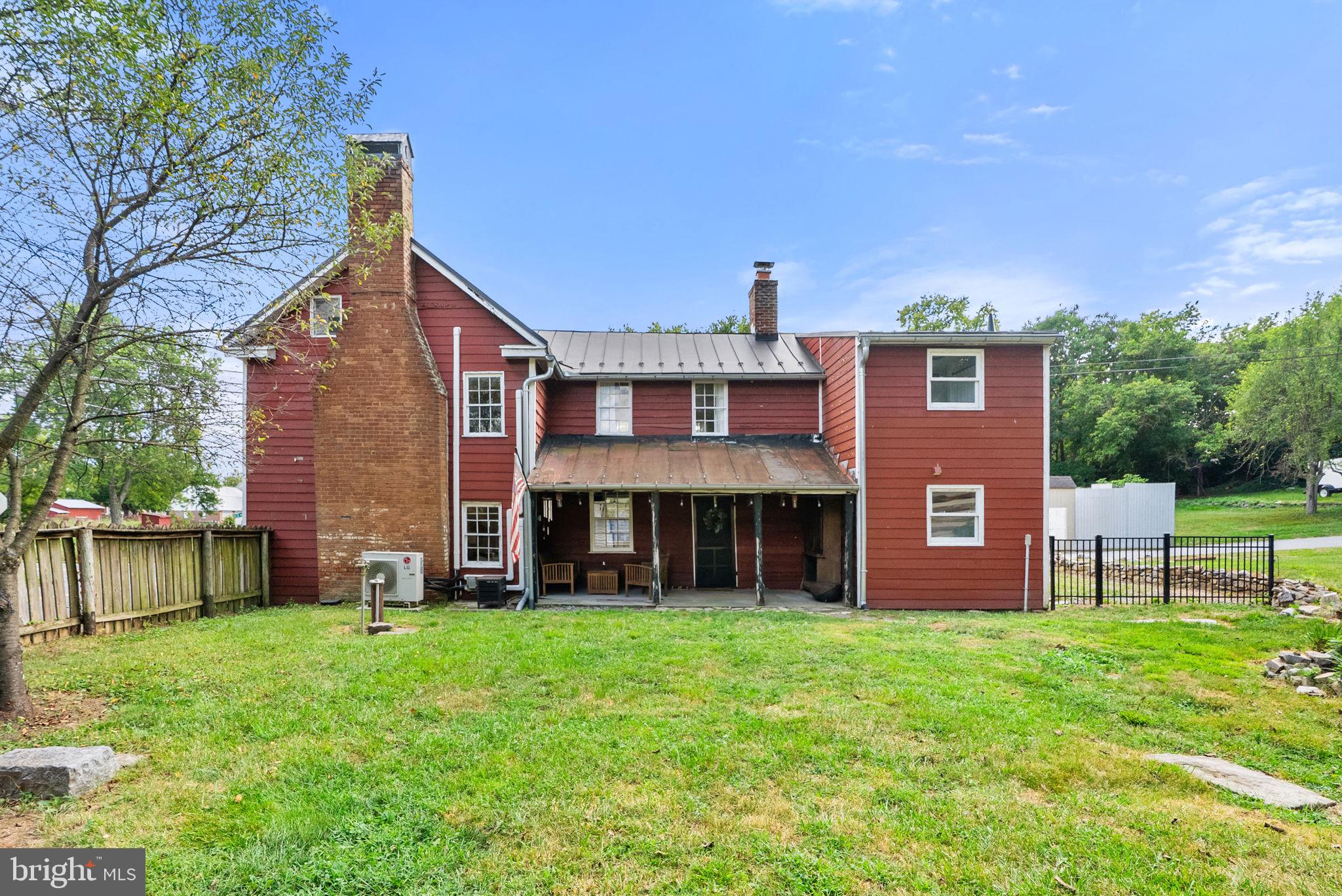 7379 Queen Street Middleway, WV 25430 - Photo 47 of 58 a view of a house with a yard and large tree