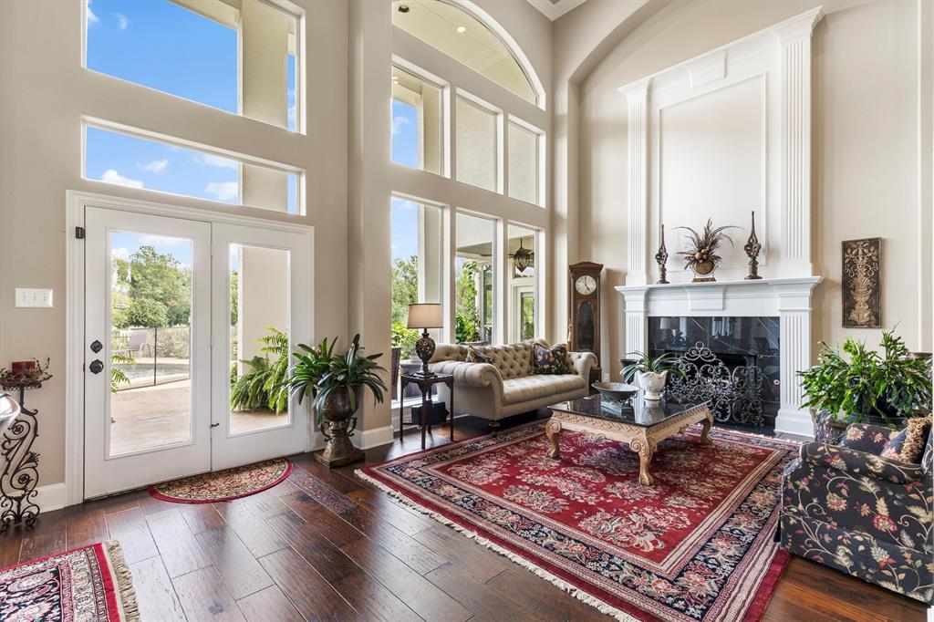 539 Ridge Point Drive Heath, TX 75126 - Photo 11 of 29 a living room with furniture large window and wooden floor