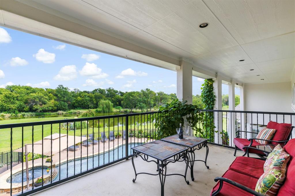 539 Ridge Point Drive Heath, TX 75126 - Photo 19 of 29 a roof deck with outdoor seating and water view