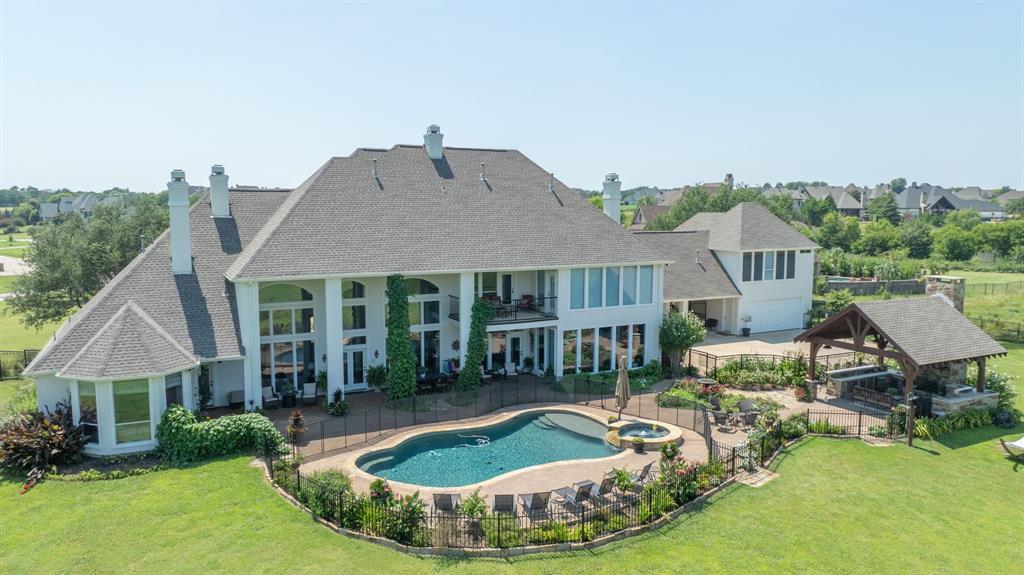 539 Ridge Point Drive Heath, TX 75126 - Photo 2 of 29 an aerial view of a house with swimming pool and furniture