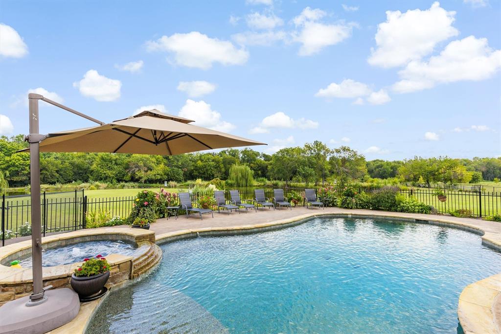 539 Ridge Point Drive Heath, TX 75126 - Photo 23 of 29 a swimming pool with outdoor seating and yard