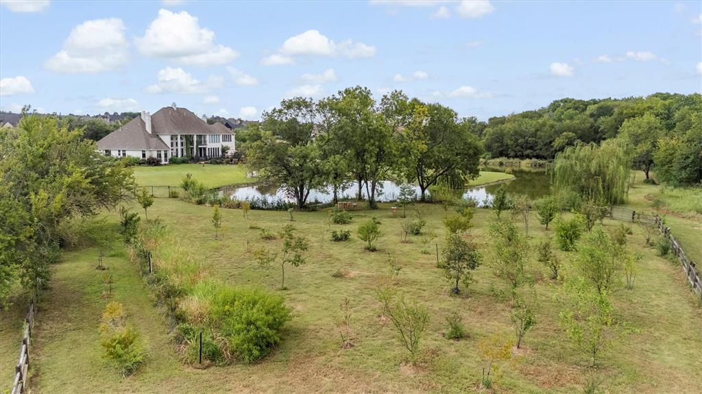 539 Ridge Point Drive Heath, TX 75126 - Photo 29 of 29 a view of a lake with a garden