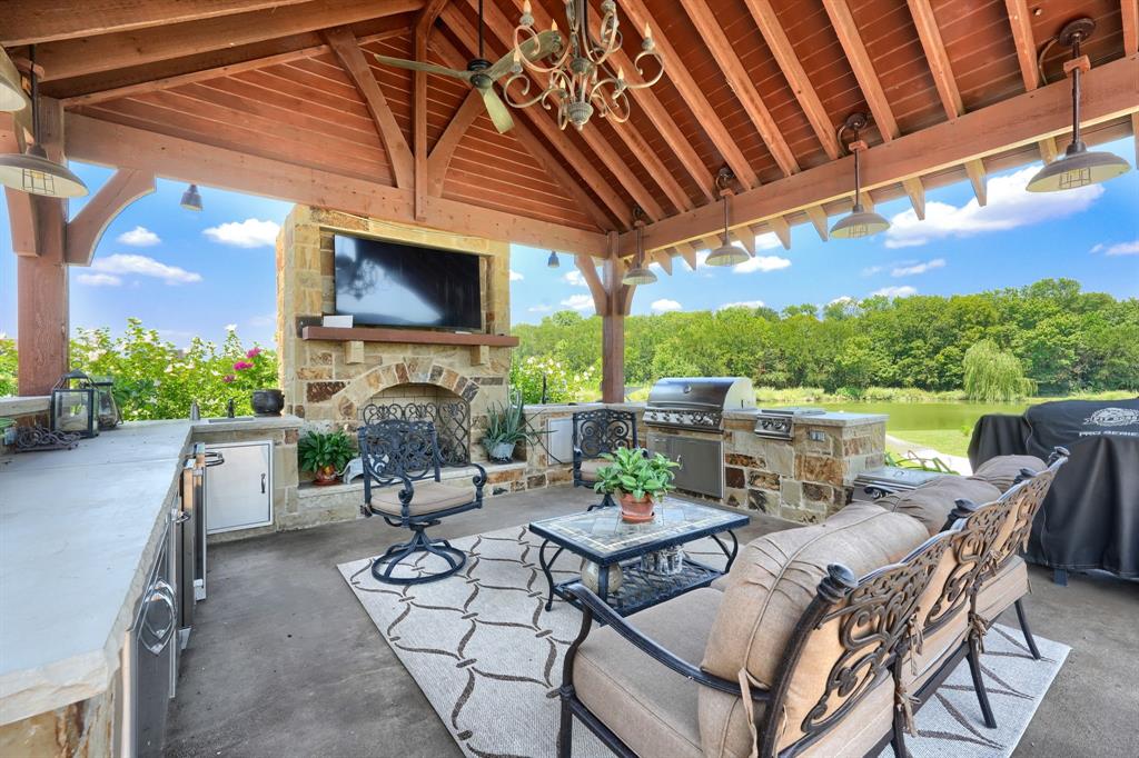 539 Ridge Point Drive Heath, TX 75126 - Photo 3 of 29 a patio with a table and chairs